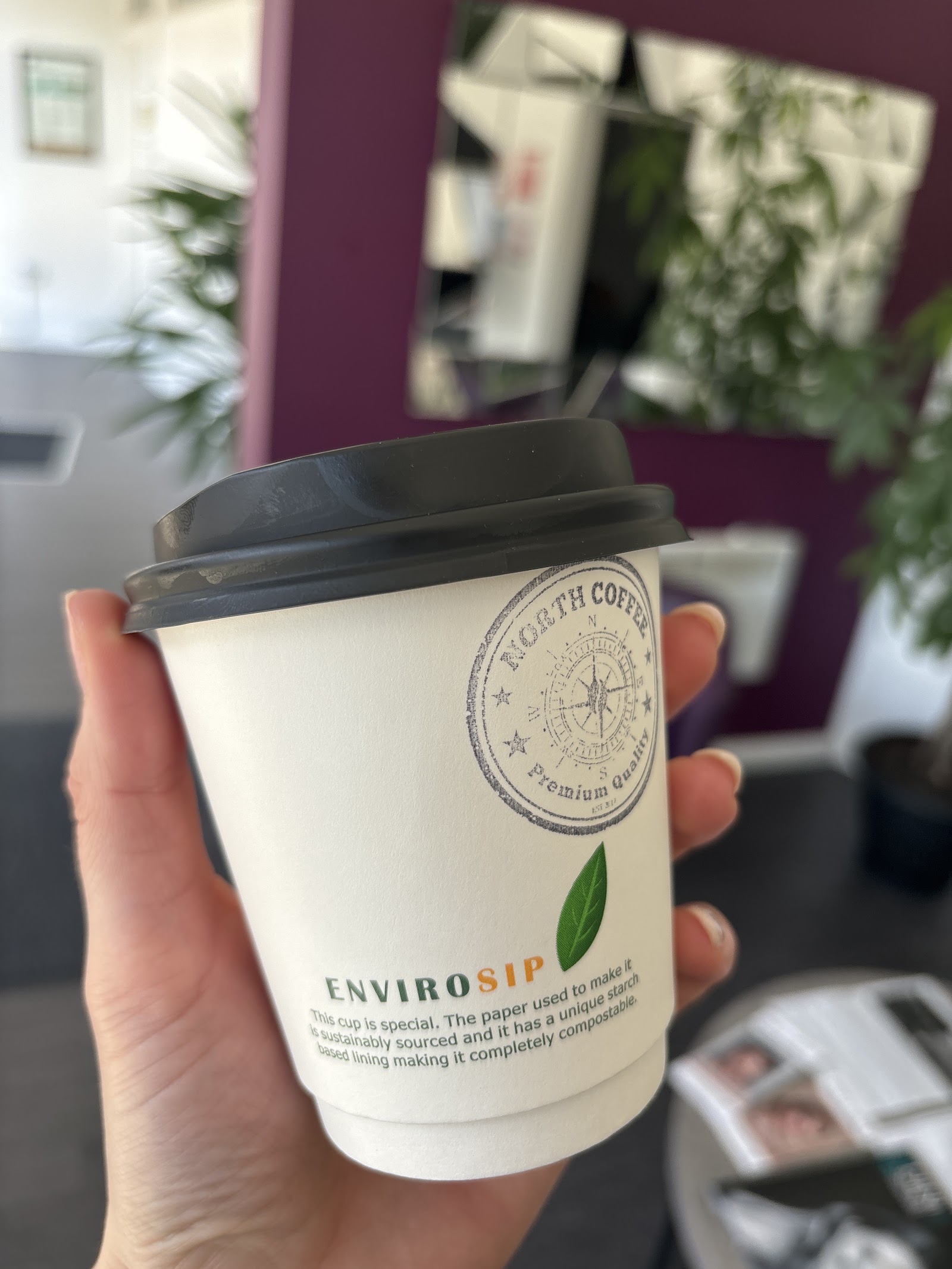 A North Coffee cup in hand